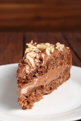 Chocolate sandwich cake garnished with flaked almonds