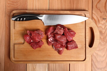 Diced beef casserole steak on cutting board