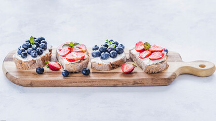 Fresh dietetic sandwiches with cheese and fruit