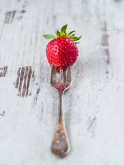 Single strawberry on a fork