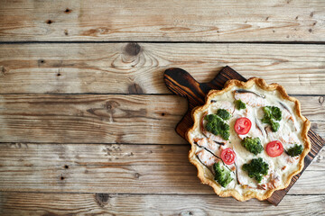 French traditional quiche Lorraine pie with broccoli and salmon