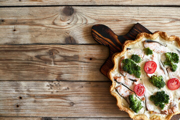 French traditional quiche Lorraine pie with broccoli and salmon