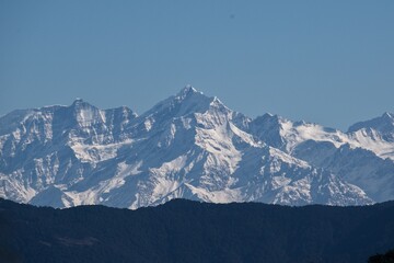 snow covered himalayan mountain peaks in winter