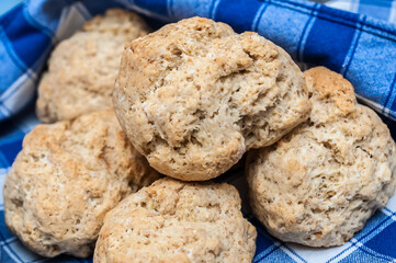 Delicious close up of scones from Eynsham Hall in a blue napkin. Exquisite english baker food. Grade II listed mansion near North Leigh in Oxfordshire, England, United Kingdom. 