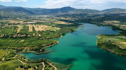 Naklejka na ściany i meble Aerial drone panoramic photo of beautiful nature in artificial lake and dam of Marathonas or Marathon that feeds drinking water supply to Athens, Attica, Greece