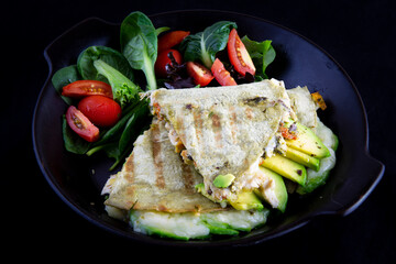 Chicken Quesadilla with avocado, dried tomatoes and jalapeno
