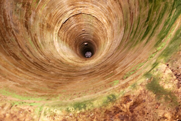 Well in the basement in the Red Stone Castle  near the settlement called Pila in Slovakia, Europe
