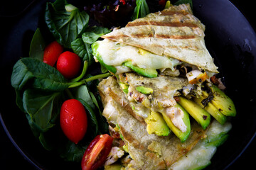 Chicken Quesadilla with avocado, dried tomatoes and jalapeno