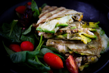 Chicken Quesadilla with avocado, dried tomatoes and jalapeno