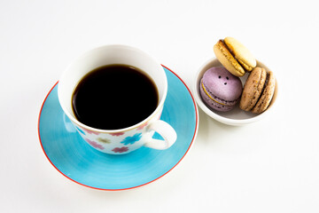 Close up from fresh macaron and black coffee