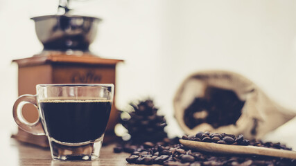 Black coffee cup with roasted coffee beans