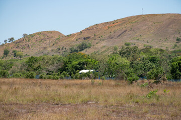Papua New Guinea, Port Moresby, 7 Mile Kennedy Estate. View from Kennedy village. Hills with some different houses on it. 