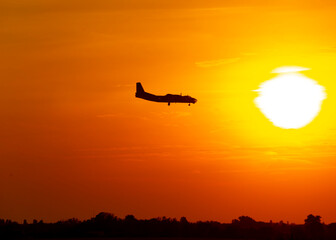 Airplane silhouette during sunset