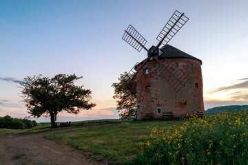 Old windmill in the field at sunset. Moravia, Czech Republic 