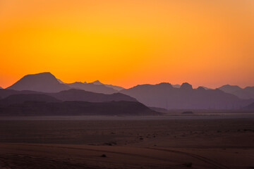Silhouette of mountains at sunset or sunrise in the desert