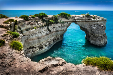 Arch shaped rocks on beach of albandeira in Lagoa, Albufeira, Portimão - Algarve