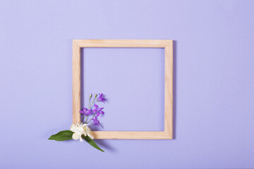 wooden frame with flowers on paper background