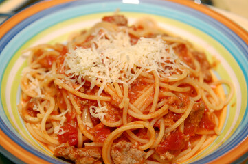 Tomato based spaghetti served on plate