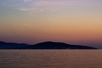 Colorful summer sunset over the sea bay.