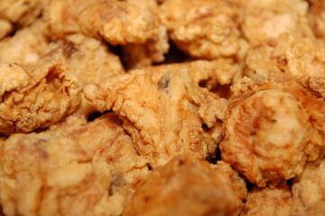 Assorted slices of crispy fried chicken served on platter