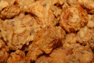 Assorted slices of crispy fried chicken served on platter