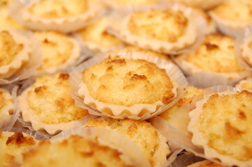 Yellow macaroon pies served in platter