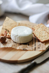 cheese camembert on wooden board