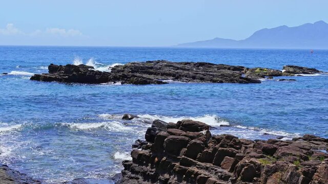waves crashing on rocks