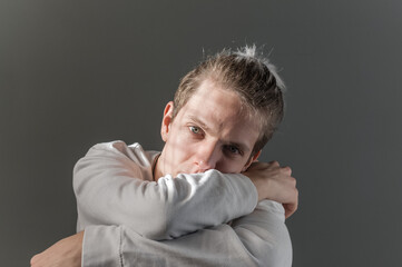 Portrait of young blond man photographed with natural light and casual clothes.