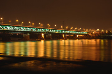 Fototapeta na wymiar Gdanski bridge in Warsaw, night photo of the illuminated brid