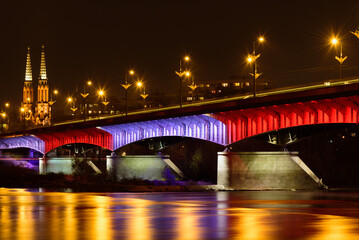 Night view on the Slasko-Dabrowski bridge over the Vistula river, Warsaw, Poland 