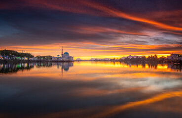 floating mosque at river during sunsety