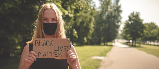 Black Lives Matter protest against the end of racism. Poster on violation of human rights. A white...