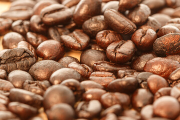 Dark roasted coffee beans background ,close up
