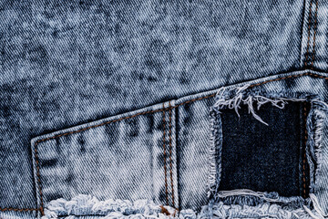Denim jeans cloth in trendy used look design. Bleached scratched fabric backdrop - stock image