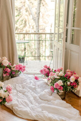 bouquets of peonies at home near balkony