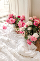bouquets of peonies at home near balkony