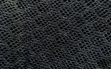 Black braided rope on the abstract background
