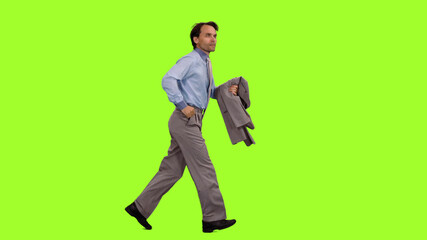 Businessman with suit jacket in hand runs on  green screen background, Side view
