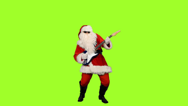Santa Claus guitarist in sunglasses playing music on green screen background - Powered by Adobe