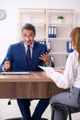 Business meeting between businessman and businesswoman