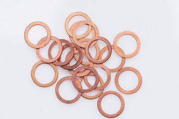 many O copper rings on the white background