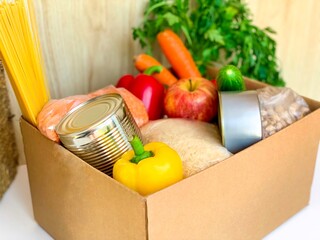supplies food help box full of vegetables, canned, cereal, pasta and fruits. donation box for delivery charity. coronavirus volunteer donation isolated on white background