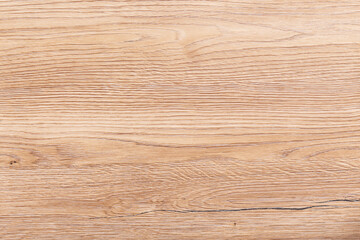 Light-brown and orange pine wood texture. Backdrop of board with tangential cut surface.