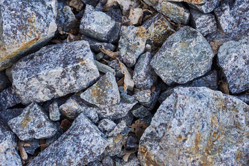 a bunch of stones lying on the ground. nature with stones.