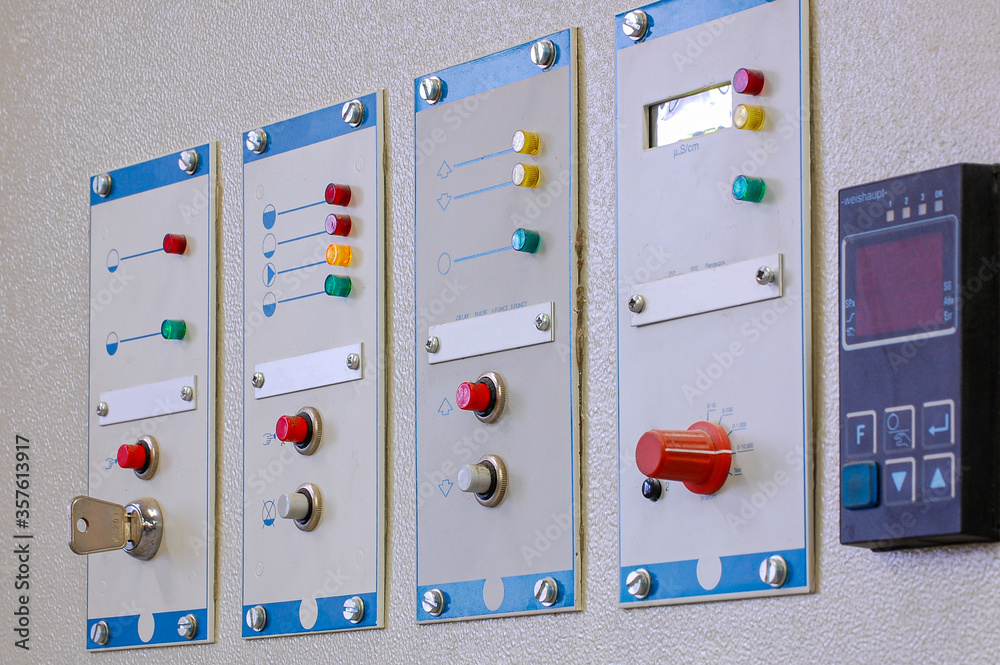 Aufkleber switches on an industrial control board. lamp indicator and switch of power control panel.