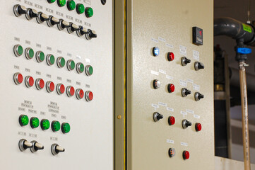 Switches on an industrial control board. Lamp indicator and switch of power control panel.