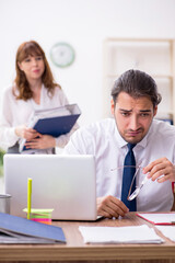 Fototapeta premium Two employees working in the office