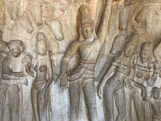 Obraz premium Bas relief rock cut sculptures of gods, people and animals are carved prominently in the monolithic cave temples at Mahabalipuram, Tamil nadu, India