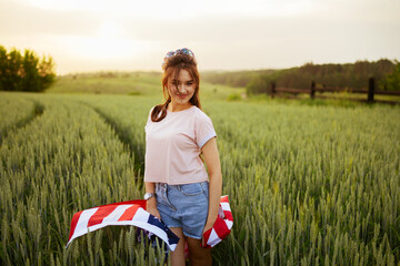 Independence day concept with woman lying down on american flag